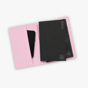 A light pink leather organizer pouch shown open, containing a black notebook and a black smartphone, on a plain white background.