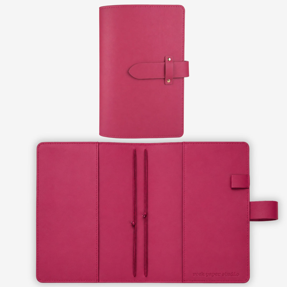 A pink leather planner or notebook cover shown closed and open on a light gray background. The closed view shows a strap closure with a small metal rivet, and the open view reveals interior pockets, a zipper compartment, and a small loop tab.